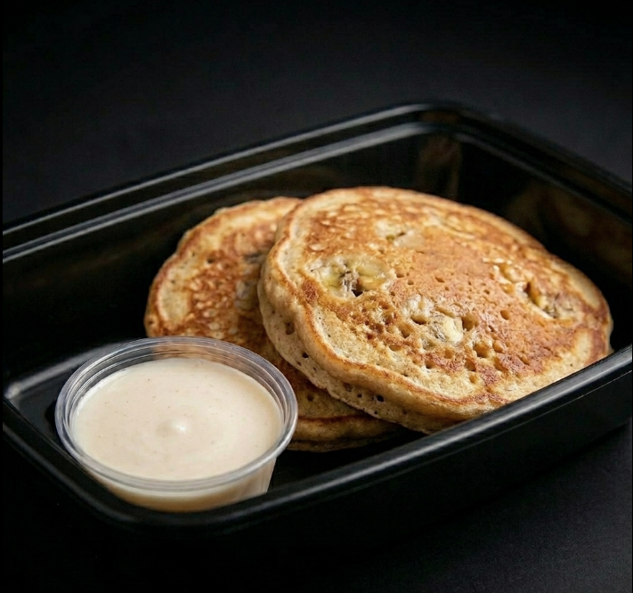 Peanut Butter Banana Protein Pancakes with 2 oz Vanilla Banana Maple Cream Drizzle on the Side